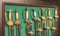 Collection of epees and rapiers of France of the 19th centuryÃÂ  on the stand with a green cloth